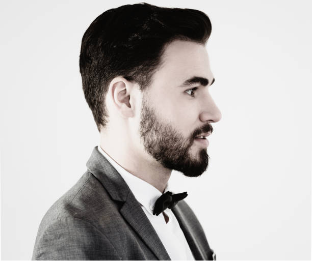 istock Young handsome man in well dressed standing with side view 1126105025
