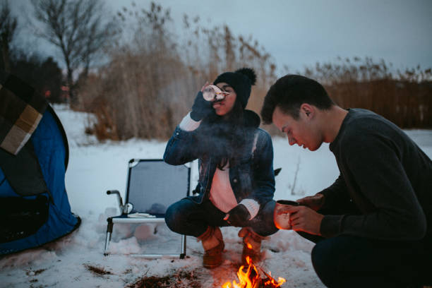 istock Couples camping in winter at the lake 1126105195