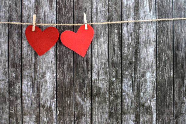 istock Valentine's hearts on a dark wooden background. 1126105888