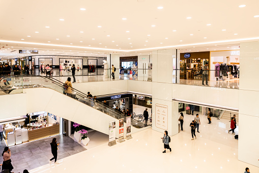 Busy scene with shoppers on escalators inside the Bullring Shopping Mall in Birmingham, West Midlands, UK on 23 July 2023