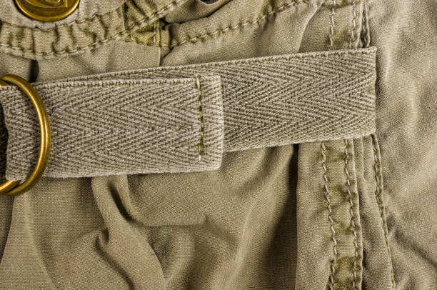 istock clothing items washed cotton fabric texture with seams, clasps, buttons and rivets 1126108587