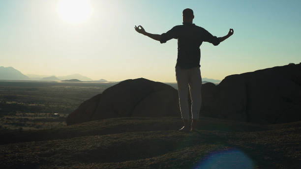istock Man open arms on huge dune. Aerial view 1126110276