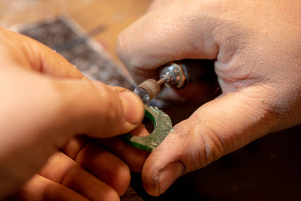 istock Jeweler working with wax model ring in his workshop 1126110589