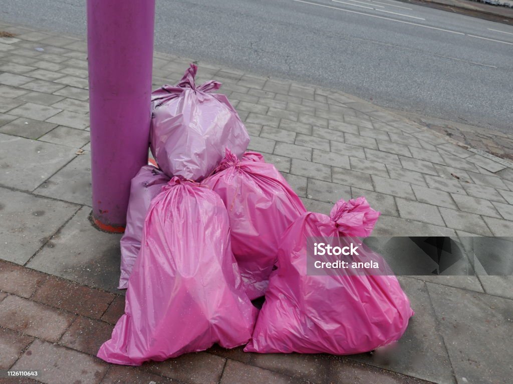 https://media.istockphoto.com/id/1126110643/photo/stuffed-pink-garbage-bags-on-the-roadside-are-ready-to-pick-up.jpg?s=1024x1024&w=is&k=20&c=Y7Nn1ATfWPH-9aRa0BlVKmy_Y3NtB6IOsh6xm47uq60=