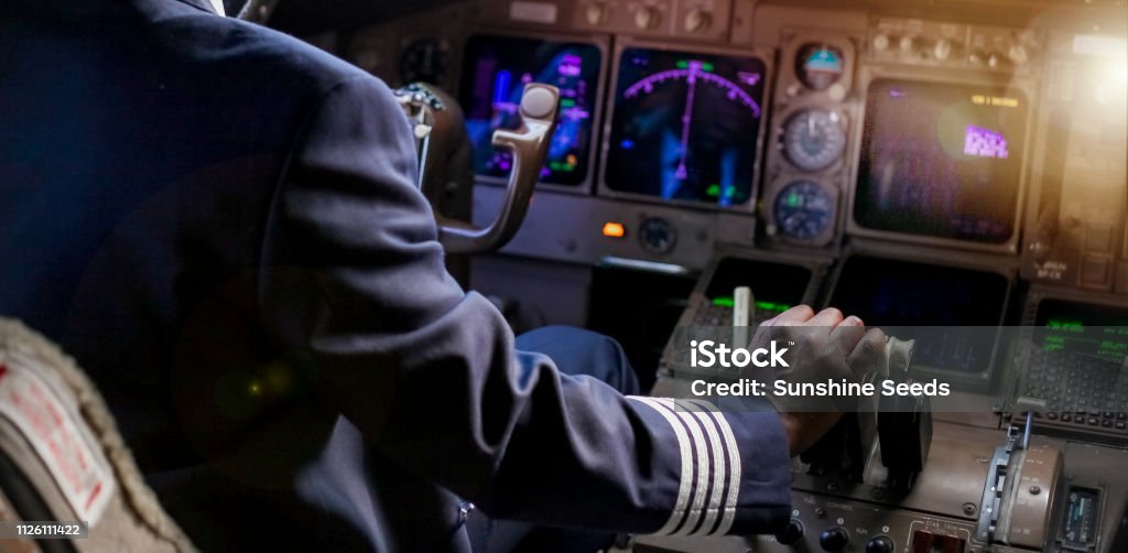 Over the Shoulder of an African Pilot in a Jumbo Cockpit Pilot Stock Photo