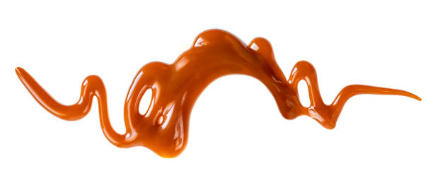 istock Caramel sauce isolated on white background. Pouring  toffee sauce spot 1126112867