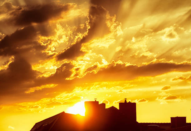 istock Sunset over roofs in the city 1126115366