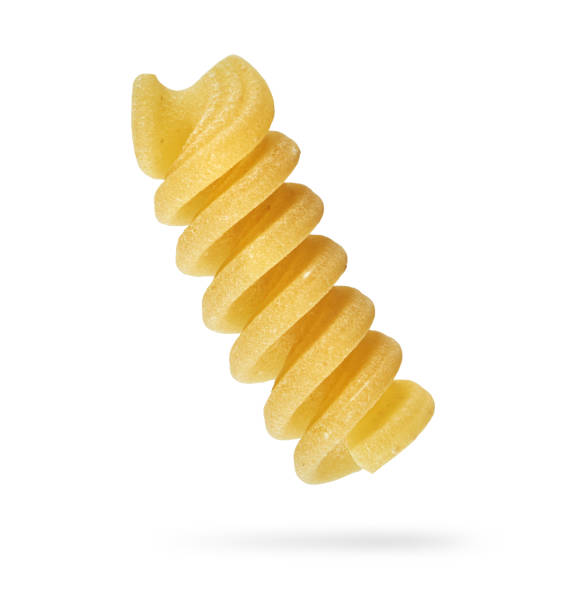 Fusilli pasta isolated with clipping path macro shot of a Fusilli pasta isolated on white with clipping path fusilli stock pictures, royalty-free photos & images