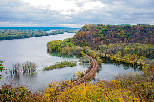 above mississippi river and woodlands during autumn at iowa border and wisconsin in distance