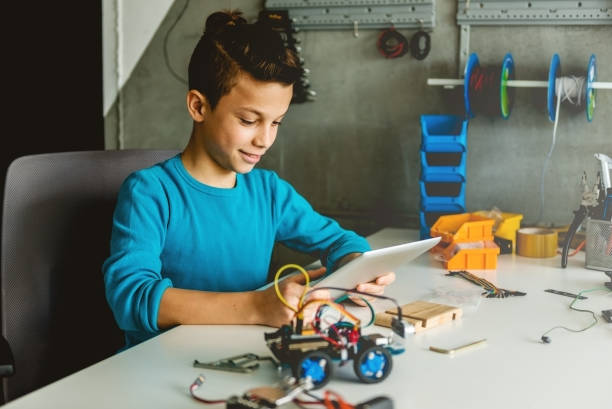 istock Teenage boy looking at digital tablet 1126121324