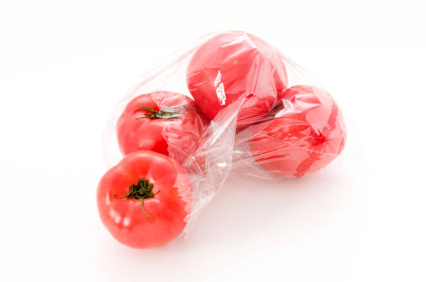 istock Ripe red Tomatoes in Plastic bag on white background 1126122027