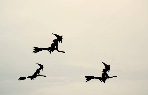 istock Funny kites - three witches flying on their brooms, Sicily. 1126122543