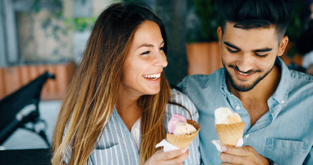 istock Happy couple having date and eating ice cream 1126122814