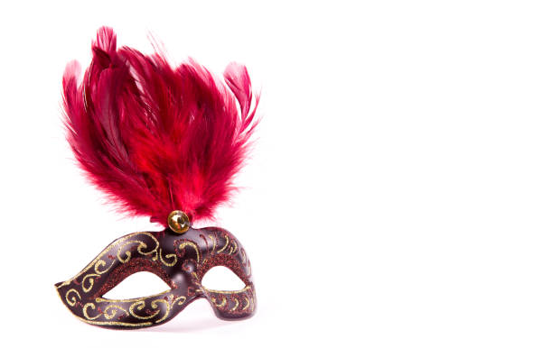istock Carnival mask with red feathers. Carnival mask on white background. Copy space 1126123027