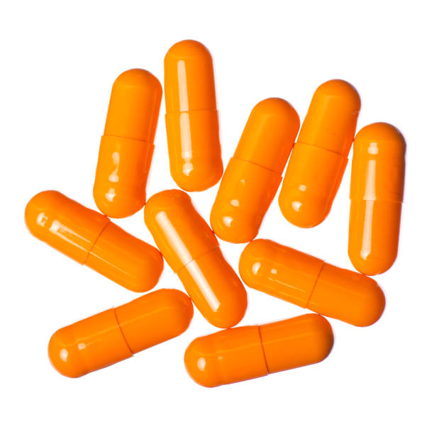 istock Capsule pills medicine pharmacy orange 1126123609