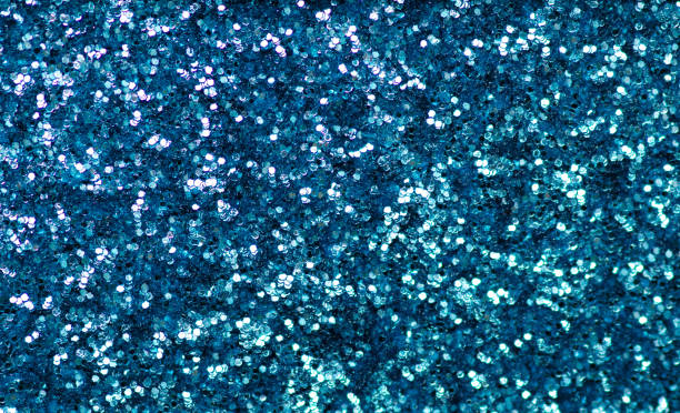 istock Blue green sparkles glitter macro background 1126123909