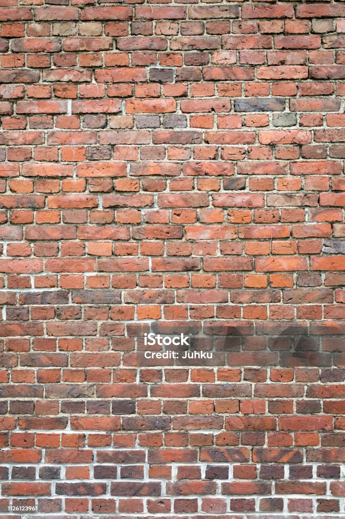 Old worn brick wall Old worn brick wall exterior pattern texture background Brick Stock Photo