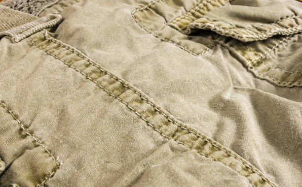 istock clothing items washed cotton fabric texture with seams 1126124956