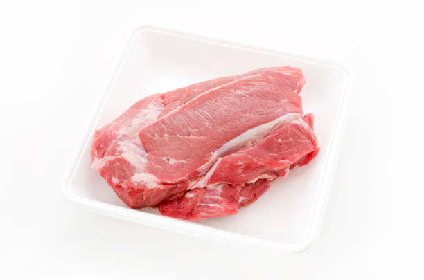 Raw Pork meat on foam tray white background