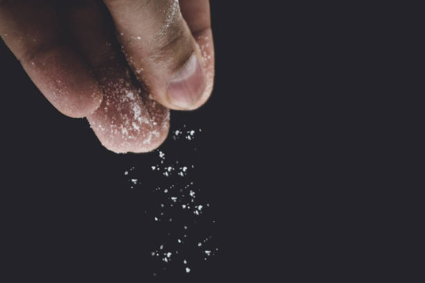 istock seasoning salt cooking on black background 1126127666
