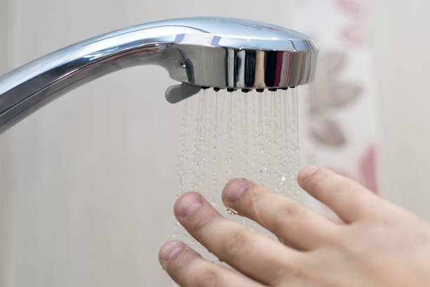 istock hand in the shower test water temperature 1126131638