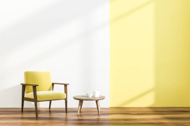 istock Armchair and table in white and yellow room 1126134042
