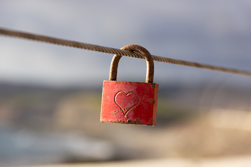 Love padlocks hanging on the wire in the port of Rijeka, Croatia