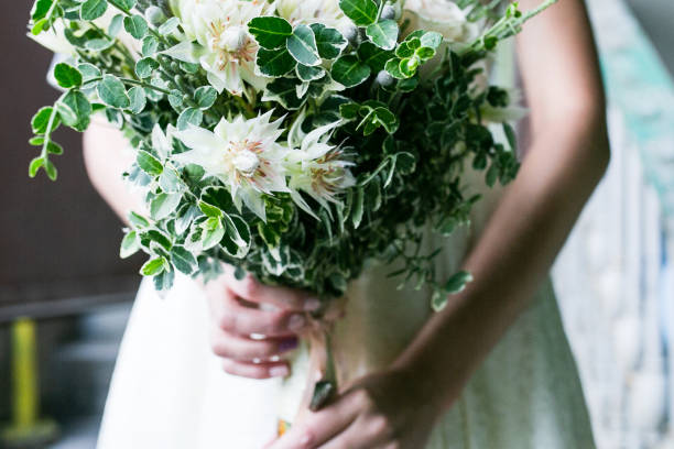 istock Beautiful rustic wedding bouquet in hands of the bride 1126137389