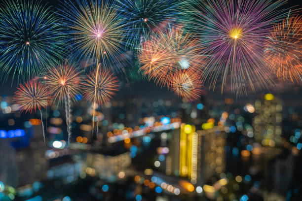 istock Fantastic Multicolor Firework Celebration over the Abstract Photo blurred bokeh of bangkok cityscape river view at twilight time, happy new year and celebration concept 1126140907