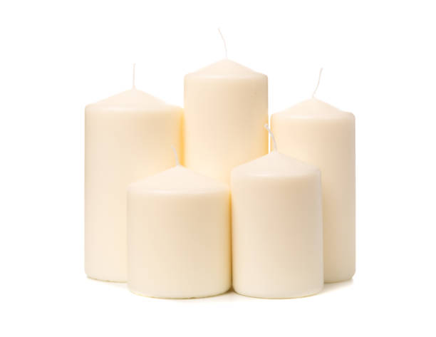istock White candle on white background isolated. Set of wax candle. 1126143185