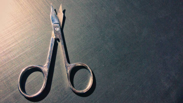 istock small nail scissors on a dark background, nail scissors, small scissors, dark background 1126145011
