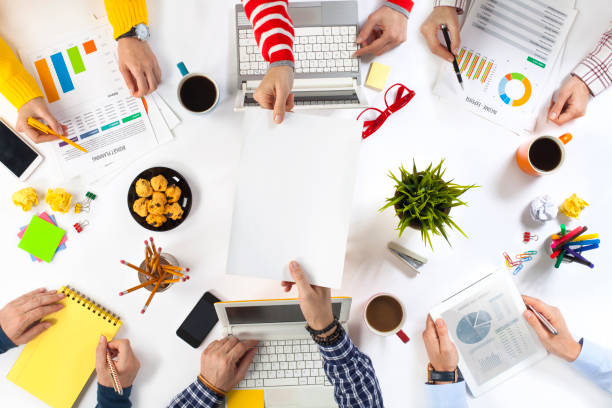 Group of Business People Working on an Office Desk