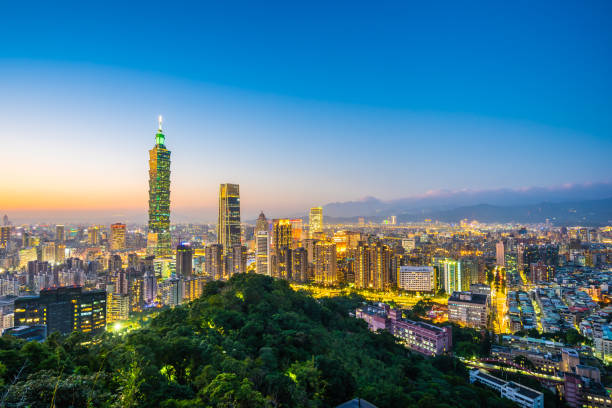 istock Illuminated Buildings In City Against Sky 1126146525