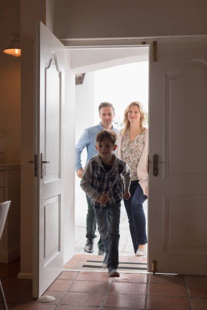 istock Happy family entering in home 1126147817