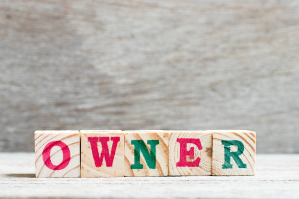 istock Letter block in word owner on wood background 1126148209