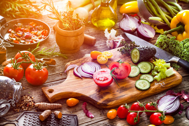 istock Fresh vegetables ready for cooking shot on rustic wooden table 1126148285