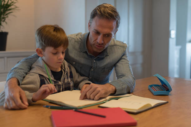 istock Father helping his son with his homework 1126151950