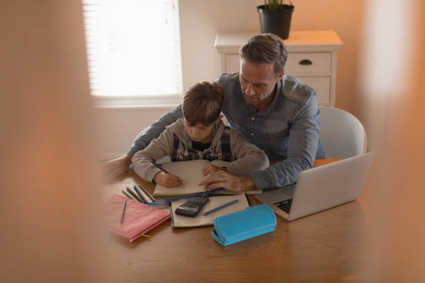 istock Father helping his son with his homework 1126153402