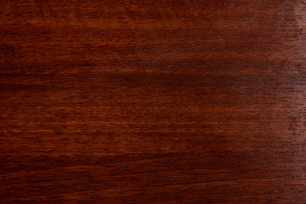 piękne brązowe tło z drewna na lakierowanej sklejce teksturowanej - mahoń zdjęcia i obrazy z banku zdjęć