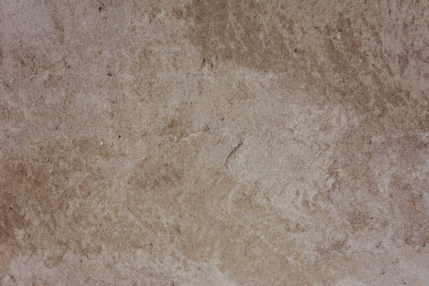 istock Beautiful background of an old plastered textured gray wall with a pattern 1126154430