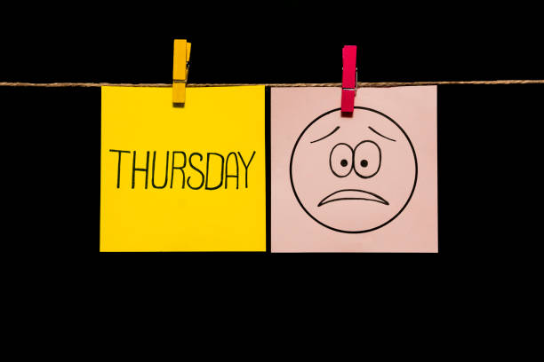 istock Copy space. Two stickers. Left on yellow sheet inscription thursday. On right page is an expression of sadness and disappointment. 1126154577