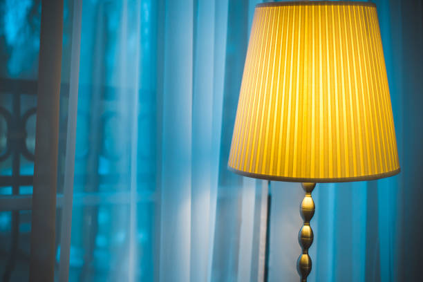 istock Cozy window seat under the lamp - winter outside the window 1126154693
