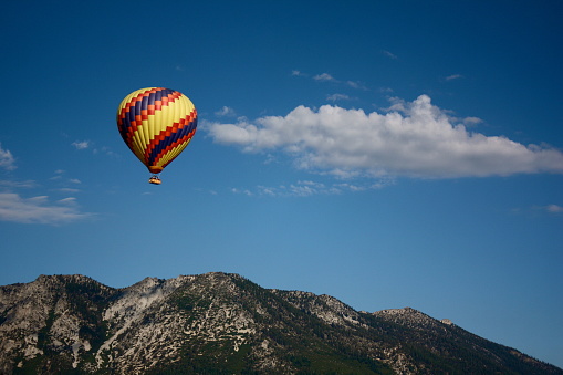 Scenic view of hot air balloon launching from the meadow in Laos