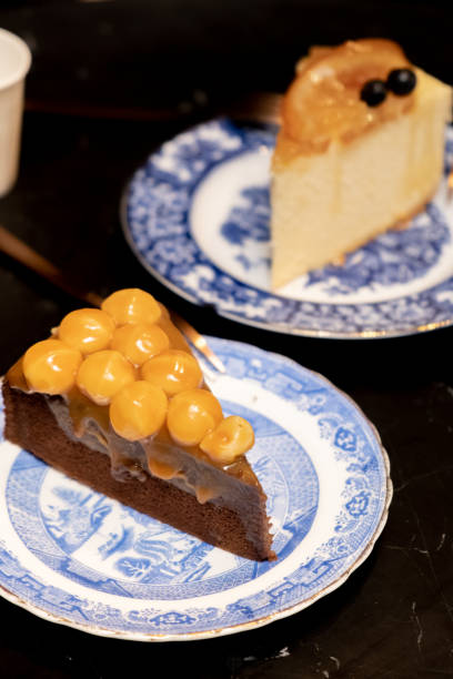 istock chocolate cake decorated with macadamia on dessert table at cafe, on dark table background 1126159814