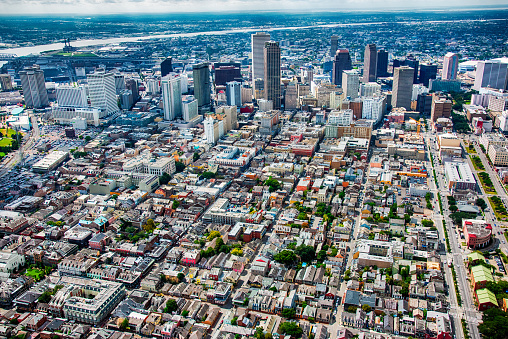 The skyline of New Orleans, Louisiana beyond the famed French Quarter shot from high above.