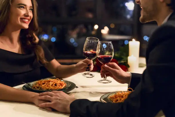 Happy couple having romantic dinner in restaurant. Happy Valentine day concept