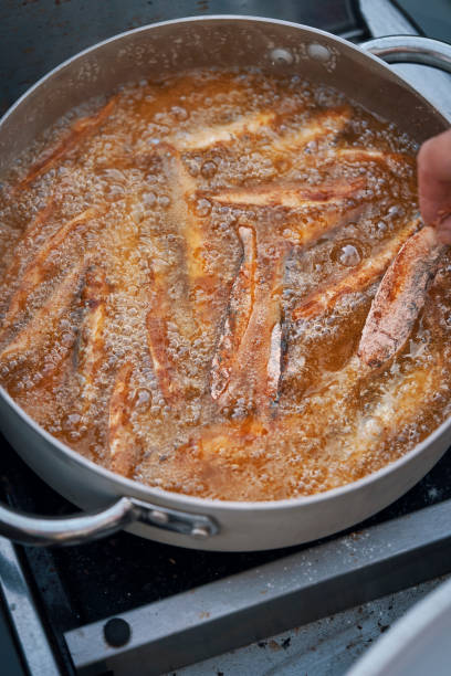 istock Frying Crispy Smelt Fish in Deep Oil 1126164935