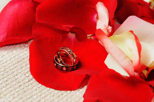 istock Beautiful wedding rings on rose petals. 1126165516