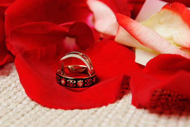 istock Beautiful wedding rings on rose petals. 1126165517