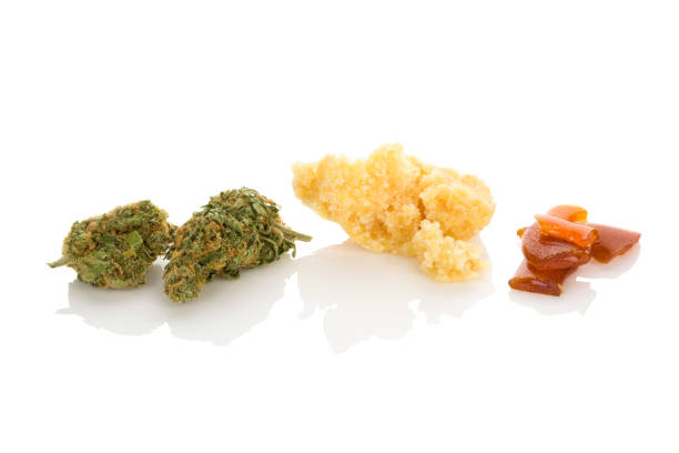 Cannabis concentrate shatter, bud and crumble. stock photo